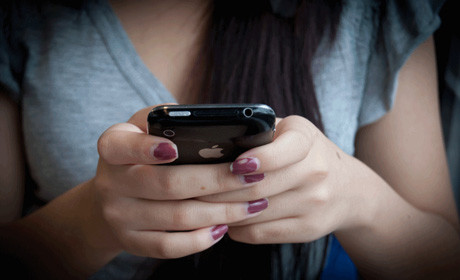 Woman with mobile phone / iPhone